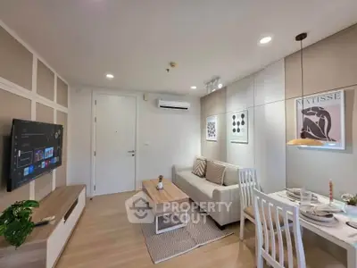 Modern living room with stylish decor and cozy dining area in a contemporary apartment.