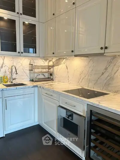 Modern kitchen with marble countertops and sleek cabinetry