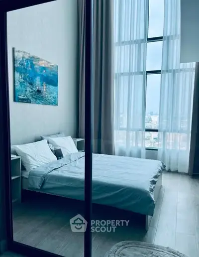 Luxurious bedroom with floor-to-ceiling windows and elegant decor