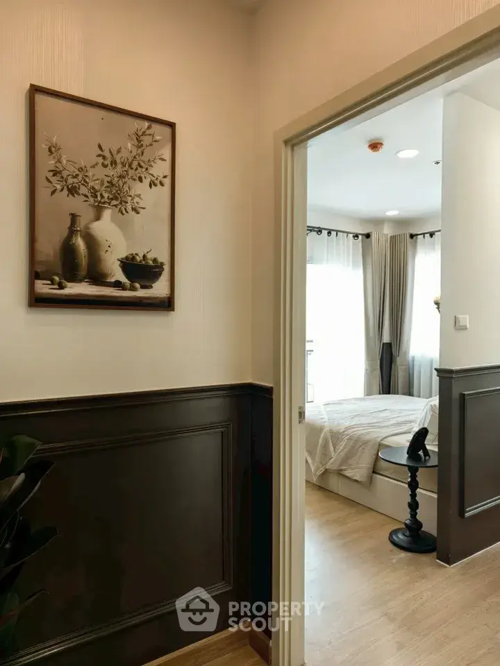 Elegant bedroom entrance with stylish decor and natural light