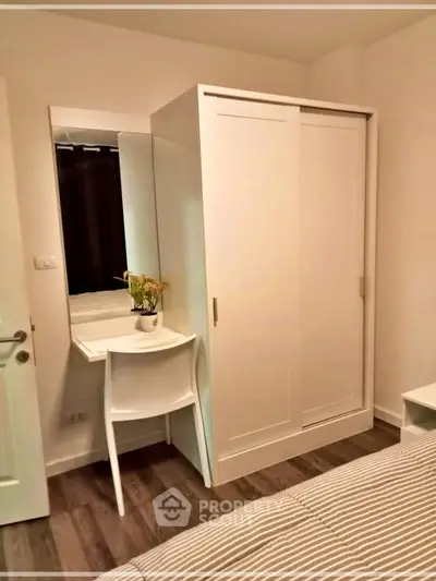 Cozy bedroom with modern wardrobe and stylish decor