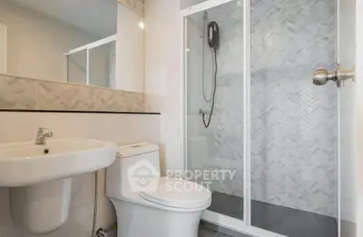 Modern bathroom with sleek shower and elegant fixtures