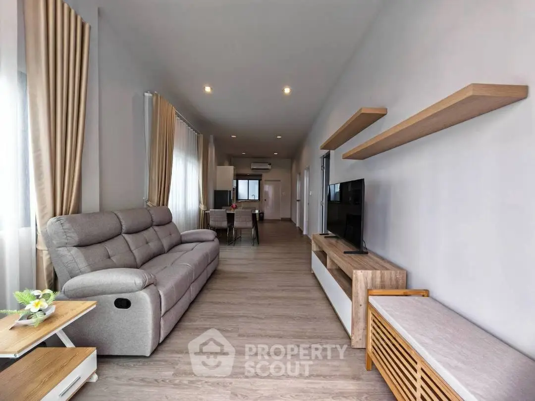 Spacious modern living room with sleek furniture and natural light