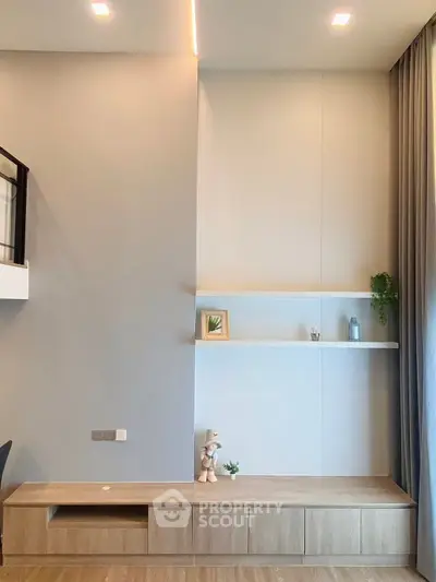 Modern living room with minimalist decor and wooden shelving