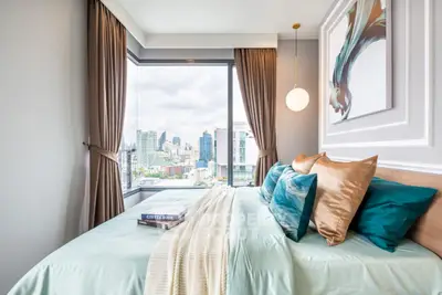 Luxurious bedroom with stunning city view and elegant decor