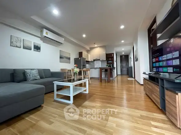 Spacious modern living room with open kitchen and stylish decor