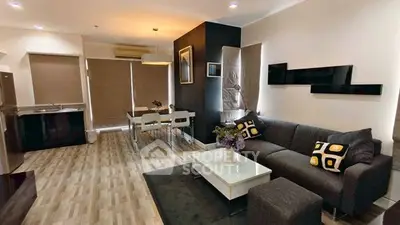 Modern living room with stylish decor and open dining area