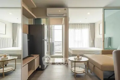 Modern studio apartment with open layout, featuring a cozy living area, sleek kitchen, and bright bedroom with balcony.