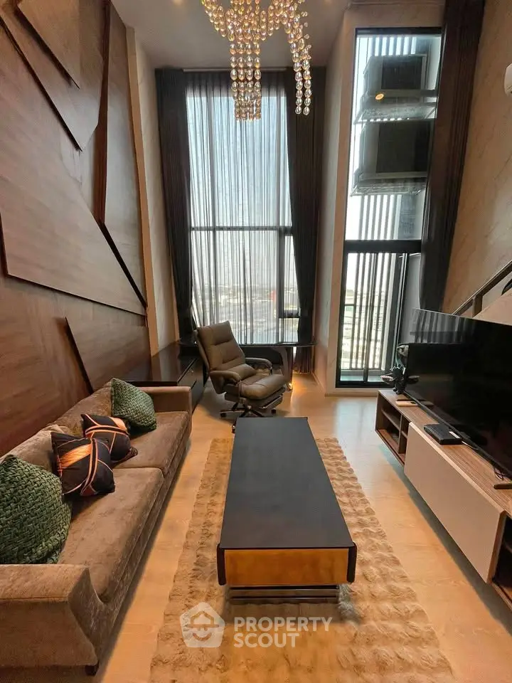 Luxurious high-ceiling living room with modern decor and large windows offering stunning views.
