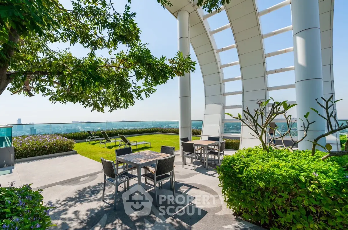 Stunning rooftop garden with modern seating and panoramic city views.