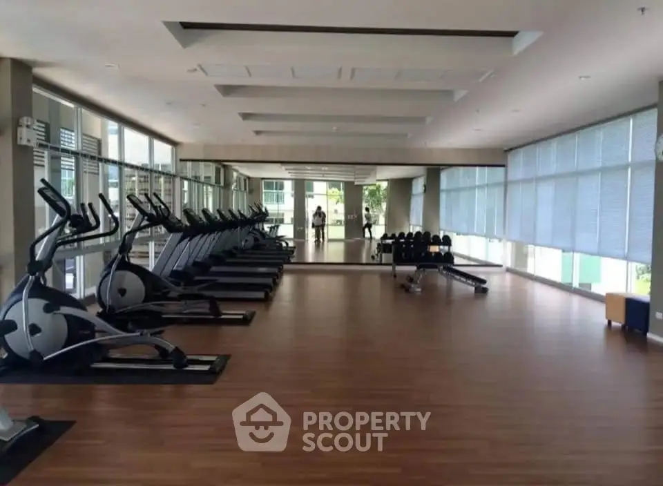 Spacious modern gym with state-of-the-art equipment and large mirrors