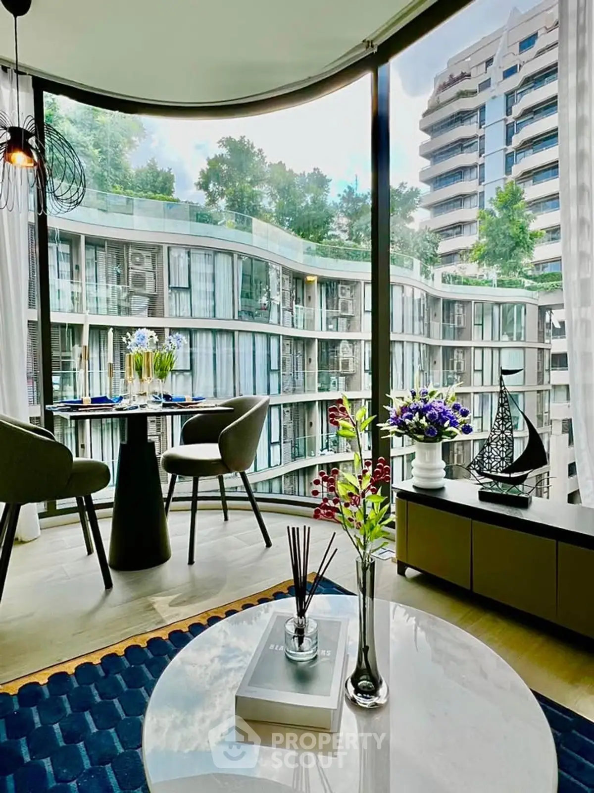 Luxurious modern living room with panoramic city views and elegant decor