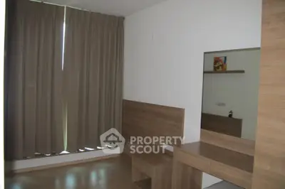 Modern bedroom with wooden furniture and large window with curtains