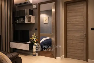 Modern apartment interior with cozy living room and bedroom view