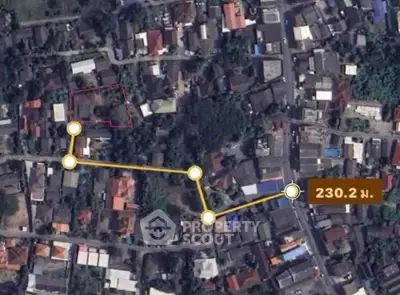 Aerial view of residential area with highlighted route and distance marker.