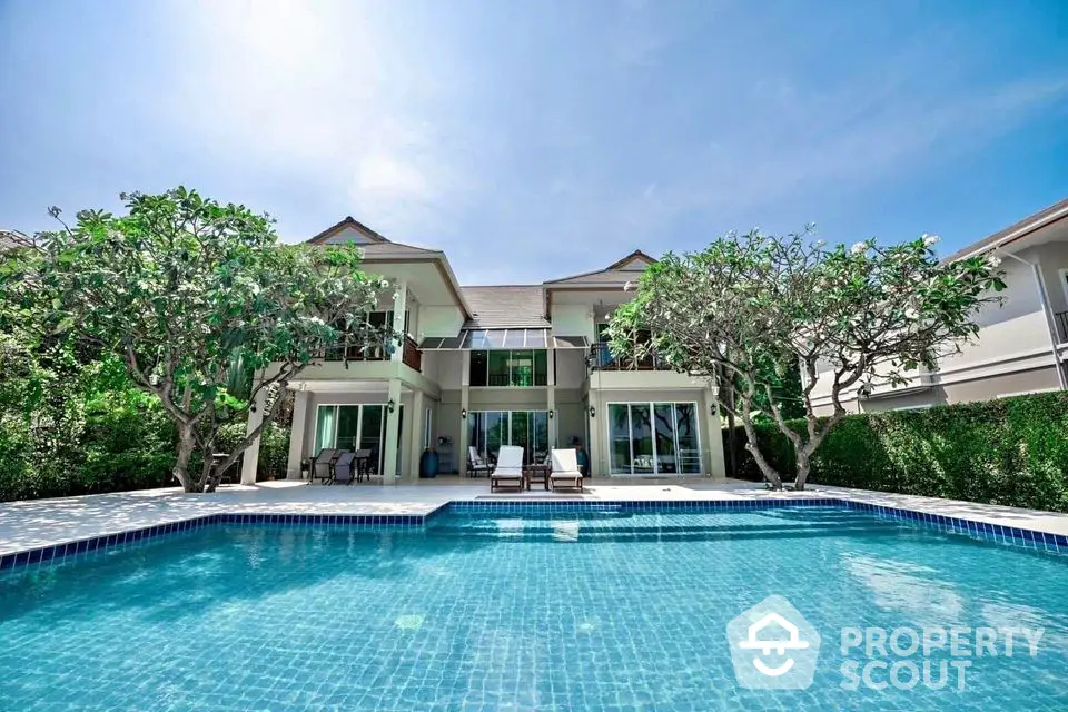 Luxurious villa with private pool and lush greenery, perfect for serene living.