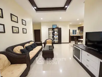 Spacious living room with elegant decor and modern furniture in a cozy apartment.