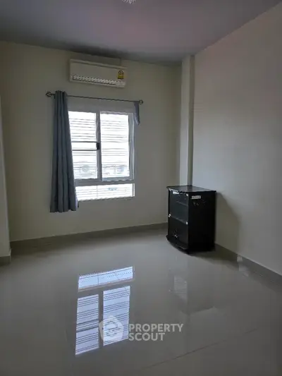 Minimalist empty room with air conditioning and glossy tiled floor