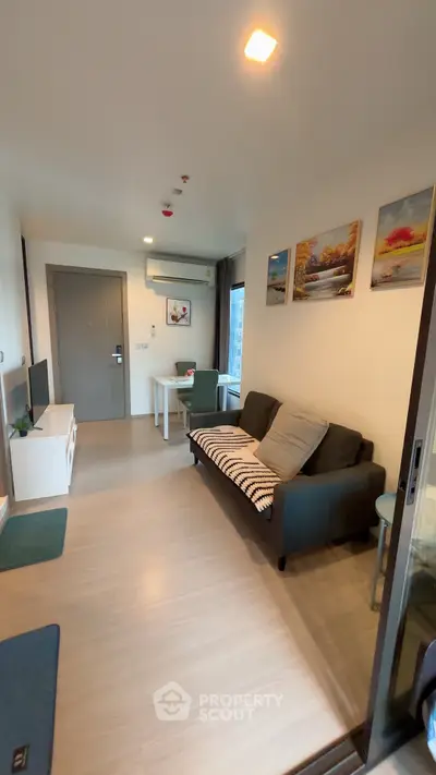 Modern living room with cozy sofa and dining area in a stylish apartment