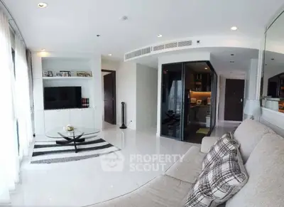 Spacious modern living room with sleek design and open kitchen layout