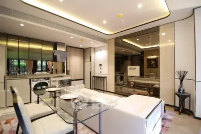 Luxurious modern living room with glass dining table and built-in appliances