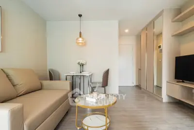 Modern living room with stylish decor and cozy seating area in a contemporary apartment.