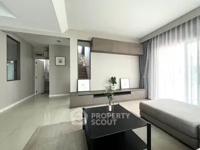 Modern living room with sleek furniture and natural light