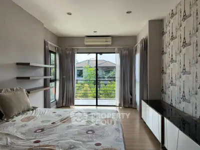 Bright and airy bedroom with balcony view in modern home