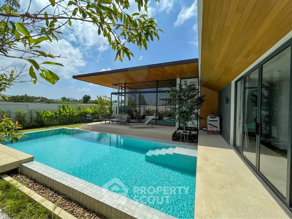 Luxurious modern villa with stunning pool and sleek architectural design, perfect for relaxation and entertainment.