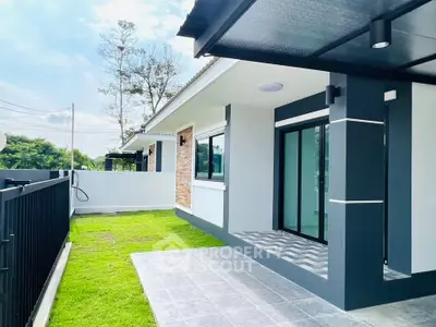 Modern single-story home with sleek design and spacious lawn, perfect for family living.
