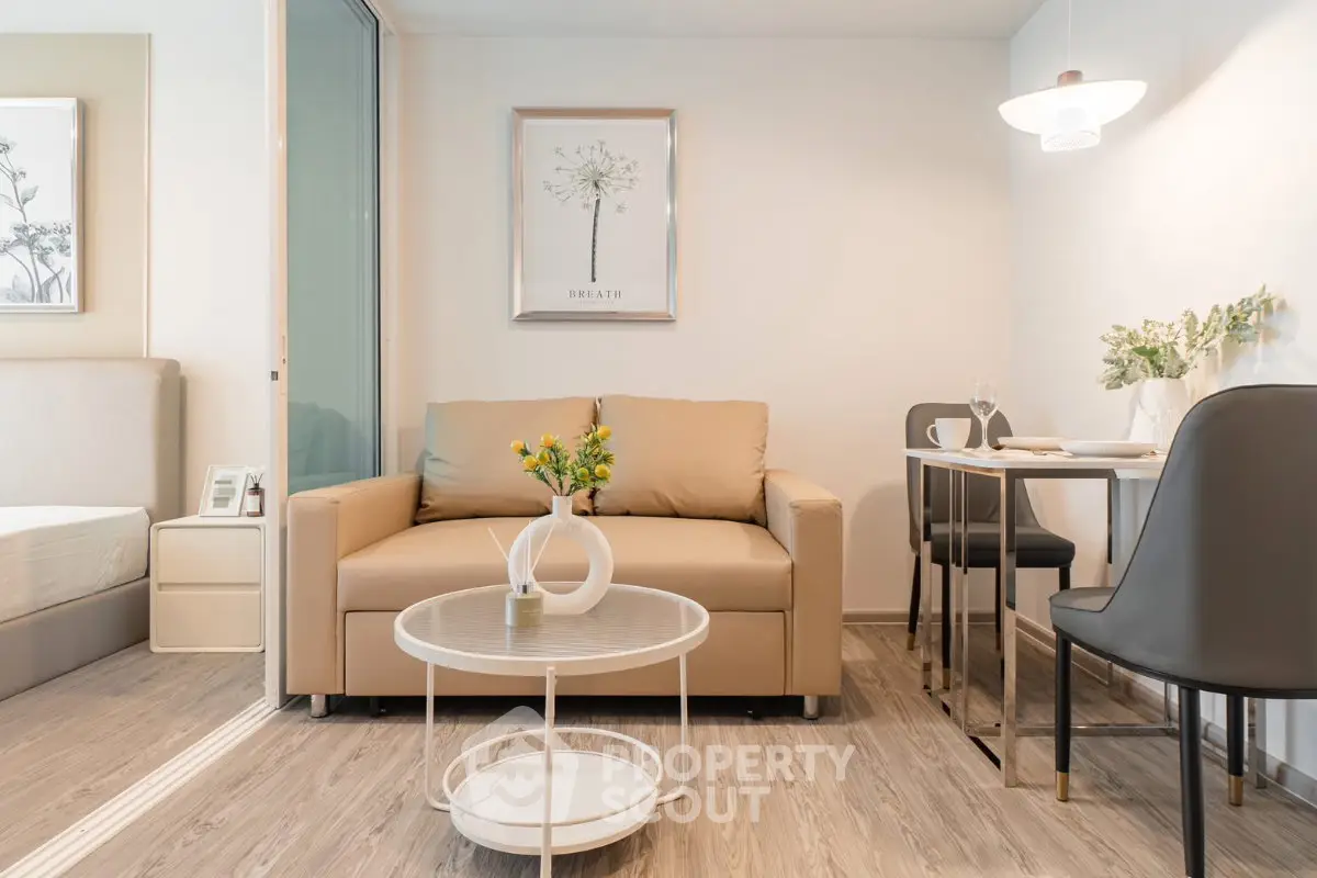 Modern living room with cozy sofa and dining area in stylish apartment