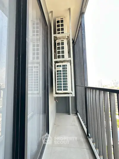 Modern balcony with air conditioning units and city view