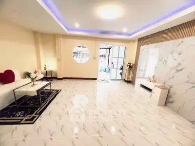 Spacious modern living room with elegant marble flooring and stylish decor
