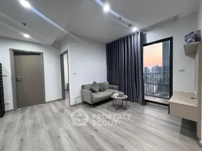 Modern living room with city view and sleek furnishings
