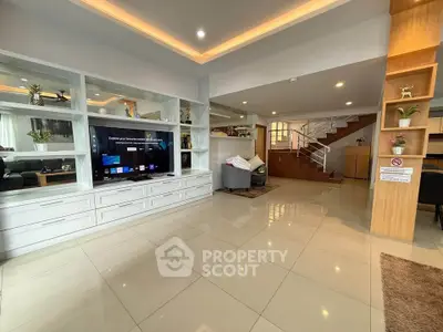 Spacious modern living room with sleek design and ample natural light