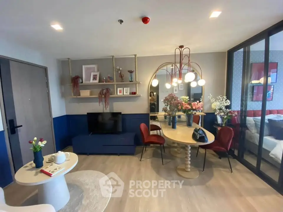 Stylish modern living room with elegant decor and open layout, featuring a cozy seating area and dining space.