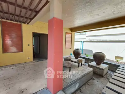 Spacious covered patio with modern design and decorative pots