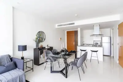 Modern open-plan living room with sleek kitchen and stylish dining area