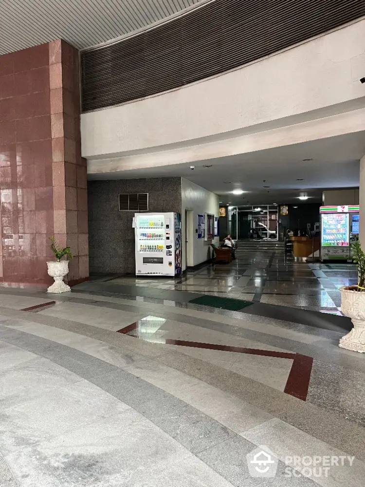 Spacious building entrance with vending machines and modern design