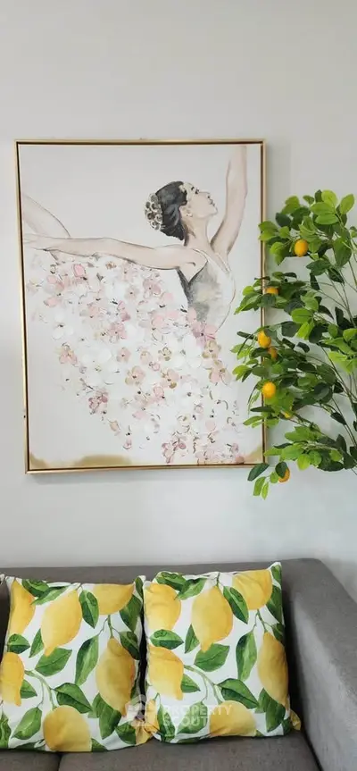 Stylish living room with lemon-themed decor and elegant ballerina artwork.