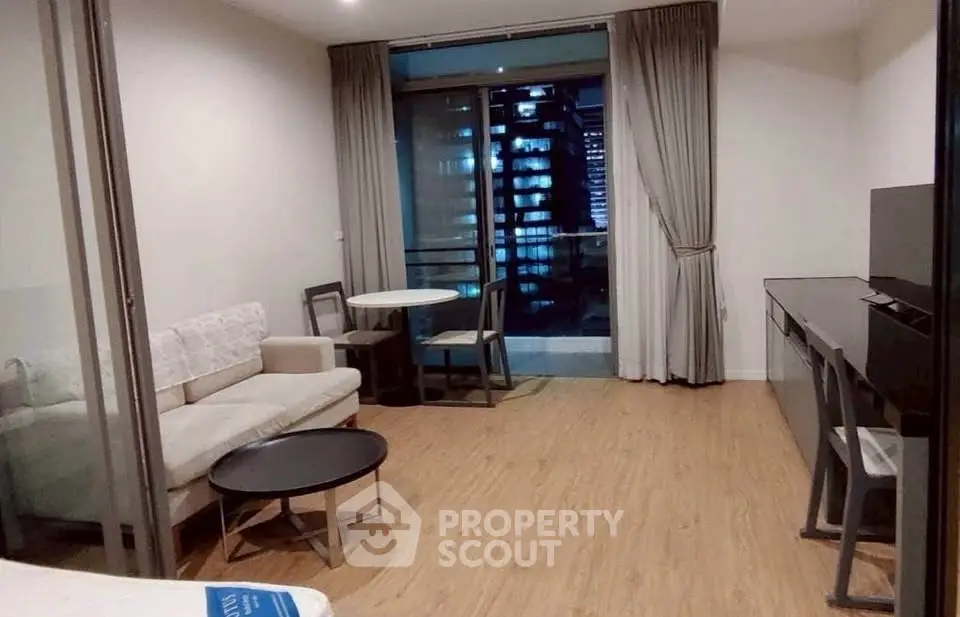 Modern living room with balcony view in urban apartment