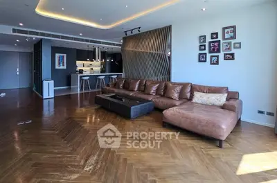 Spacious modern living room with elegant wooden flooring and stylish decor