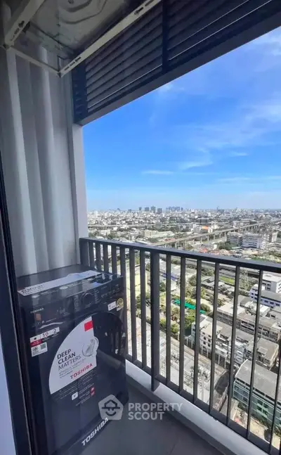 Stunning high-rise balcony view with cityscape and modern washing machine.