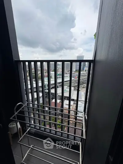 Urban balcony with cityscape view, perfect for enjoying skyline vistas.