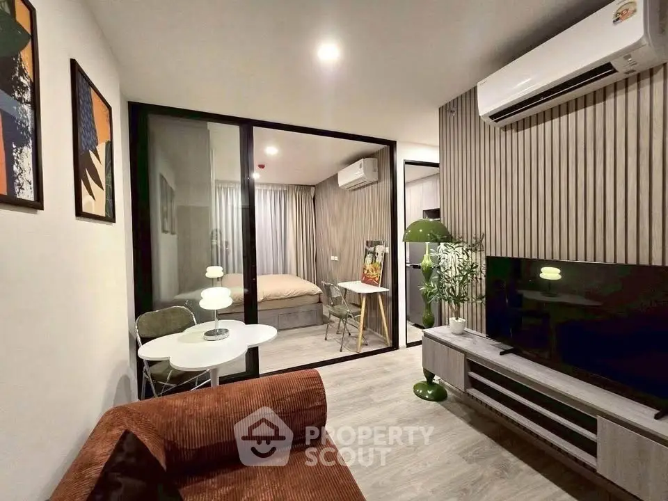 Modern living room with stylish decor and cozy bedroom view