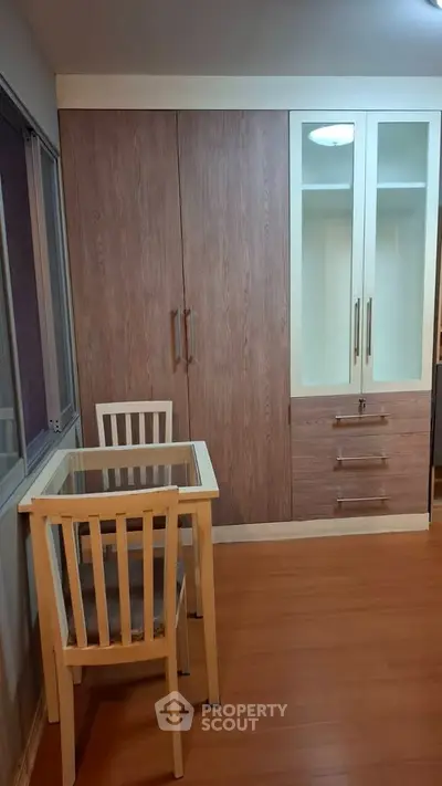 Cozy study area with wooden flooring and built-in wardrobe