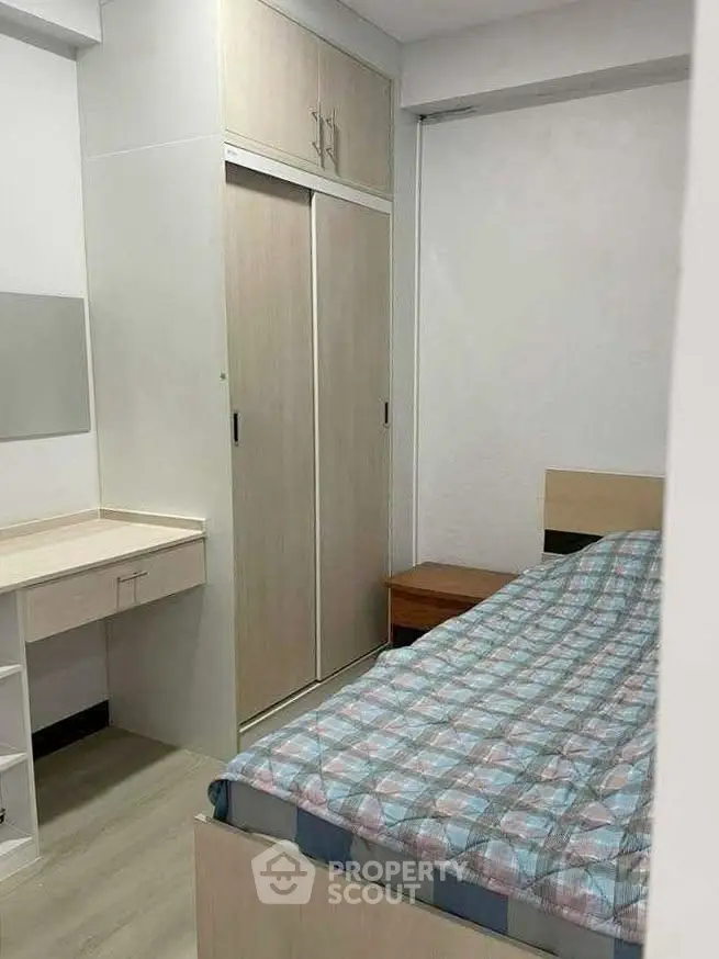 Cozy bedroom with built-in wardrobe and modern decor