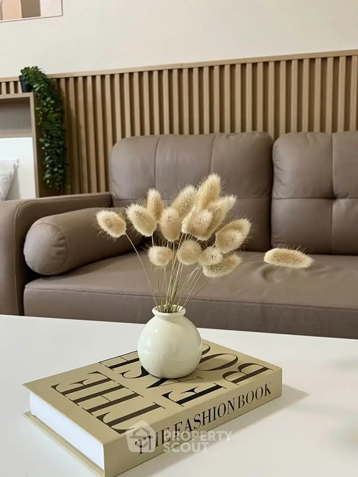 Stylish living room with modern decor and cozy sofa, perfect for relaxation.