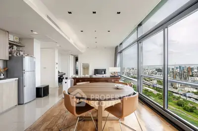 Stunning modern apartment with panoramic city views and open-plan kitchen.