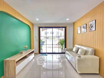 Modern living room with sleek design and large window view